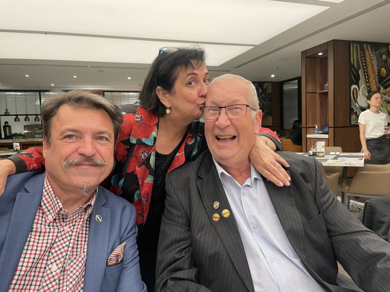 Maree kissing her husband, Ian Pickens, her biggest supporter and a past two-time District Director.